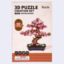 Packaging for the Rolife Sakura Bonsai 3D puzzle, featuring a photo of the fully assembled puzzle and specs about the product.