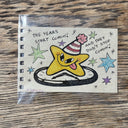 Painting of a cartoon star wearing a striped party hat, with stars around it.