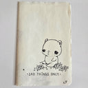 Ink drawing of a small, cute cartoon bear crying in a field of flowers with text that reads "sad things only"