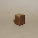 Wooden block on a beige background