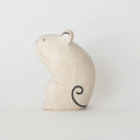 Small white wooden figurine of a mouse with a painted on curling tail and small whiskers.