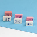 6 small rectangular Milan erasers in pink and white, each printed with a different animal illustration and number, arranged on a blue surface.