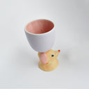 Ceramic gray cup with a brown and pink  floppy eared dog as a handle.