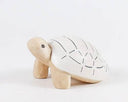 Wooden figurine of a turtle with a patterned shell