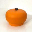Tangerine shaped and designed ceramic piece.