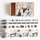 Set of washi tapes with cat designs in a decorative box on a white background