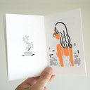 Illustrated book spread with a potted plant on one page and a women on the other, facing away from the viewer with long hair and glasses..