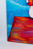Colorful illustration of Snoopy, sitting atop of his red dog house reading a book, a pile of books sits nearby. The sky is blue with blue clouds. Close up shot shows color detailing.