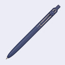 Blue pen with a silver clip on a light purple background
