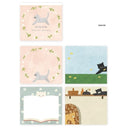 Display of memo pad with 4 different sheet designs, focused around cats.