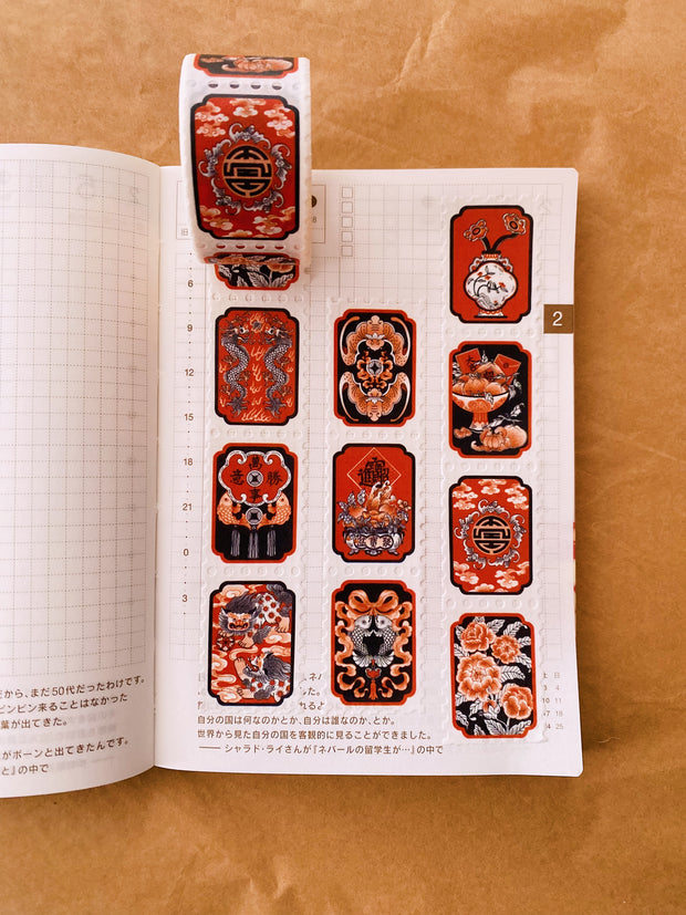 Stamp shaped washi tape featuring Asian thematic illustrations in orange, black and white.