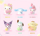 Set of fluffy Sanrio Characters in flocked pastel colored costumes, all holding small objects.