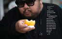 Table of contents, positioned over a photograph of a person with sunglasses holding a piece of food.