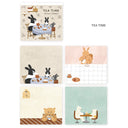 Memo pad with 4 different page designs of animals having tea.