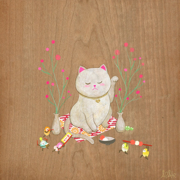 Painting done on exposed wooden panel of a white cat, sitting on a mat with a gold collar and one of its arms up, mimicking the maneki popular in Asian culture. Around are 2 blossoming branches and small colorful characters holding up food and playing music.