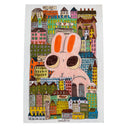 Illustration of a large cartoon pink rabbit sitting amongst many buildings with several windows.