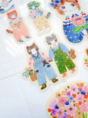 Colorful cat-themed stickers on a white background
