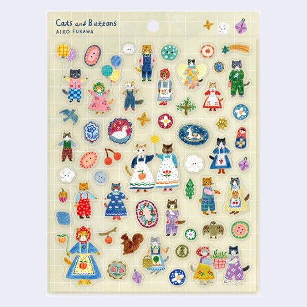 Sticker sheet with many die cut stickers of cats dressed in dresses, pajamas and pants. Other stickers include colorful buttons, fruit, birds, and other nature elements.