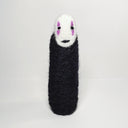 Needle felt wool sculpture of No Face from Spirited Away, standing without any visible limbs (arms or legs).