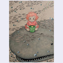 A surreal illustrated scene showing a small child with pink hair in a pink outfit sitting on a large gray whale, holding a green bucket, with many small fish and bubbles around them.