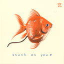 Illustration of a pooping goldfish with text 'stuck on you' on a beige background