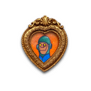 A heart-shaped gold frame featuring a hand-painted illustration of a cartoon character with a green helmet and blue shirt on an orange background, set against a plain white backdrop.