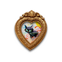Heart-shaped frame with a black cat painting inside on a white background