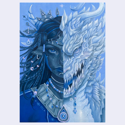 Artistic depiction of a woman with a dragon half on her face against a blue background