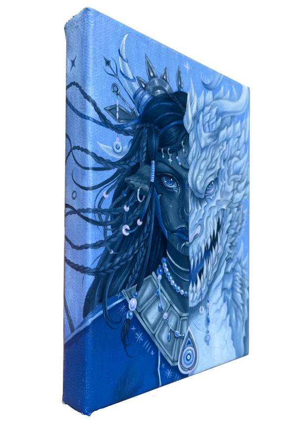 Canvas painting of a dragon and woman's face design on a blue background