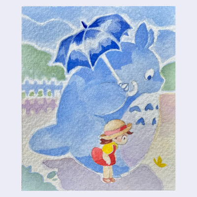 Watercolor illustration of a blue Totoro, holding an umbrella and looking down at a butterfly with a little girl at his side.