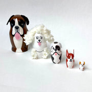 Set of 5 nesting dolls, shaped like dogs. Each breed is different and painted accordingly.