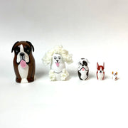 Set of 5 nesting dolls, shaped like dogs. Each breed is different and painted accordingly.