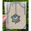 Illustration on brown paper of a tiny one-eyed goblin chained into an even tinier home, hanging from its chains like a swing.