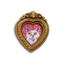 A heart-shaped gold frame featuring a painted white cat with orange eyes against a pink spiderweb background, shown on a plain white background.