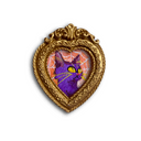 A heart-shaped ornate gold frame with a purple cat illustration inside, set against a plain white background.