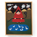 Framed artwork of a person in a red triangle shaped outfit with a snake, surrounded by birds and ducks.