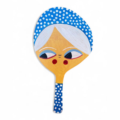 Paddle with a face design on a white background