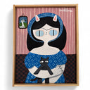 Framed artwork of a stylized cat person with black hair, blue eyes, and a blue dress and matching headscarf. They hold a cat on a pink and brown patterned background.
