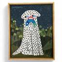 Framed artwork of a stylized white dog with black spots, holding a blue fish in its mouth with a night sky and trees in the background