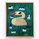 Framed artwork of a stylized bird on a green background with houses and trees.
