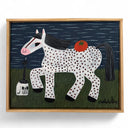Framed artwork of a spotted horse with a tomato on its back and a skull near its feet, on a grassy field with a dark sky.