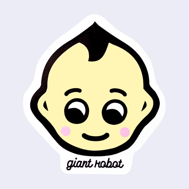 Die cut sticker featuring a stylized Kewpie baby face, with a sweet smile. It has a thick black outline and pink cheeks. Text below reads "giant robot"