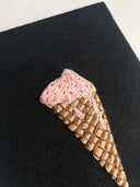 Embroidered ice cream cone, melting onto the cone.