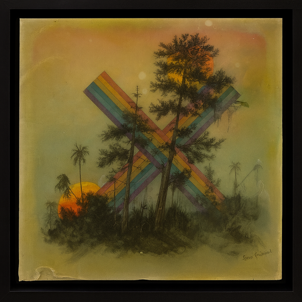 Artistic depiction of an x made with rainbow colors against a sunset sky with trees and palm trees.