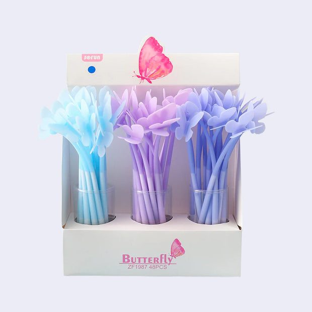 Display box of 48 pens with butterfly toppers. Colors are blue, light purple and a bluish purple.
