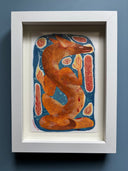 A stylized painting of a fox-like animal in warm orange-brown tones on a blue background, surrounded by abstract red and cream shapes, in a white frame.