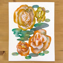 Watercolor illustration of orange and yellow roses with soft watercolor coloring on each of the petals in a dissipated manner. Green leaves in the shape of circles are around the flowers.