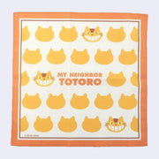 Handkerchief with orange border and repeating patterns of Catbus heads, with text that reads "My Neighbor Totoro" in the center in orange font.