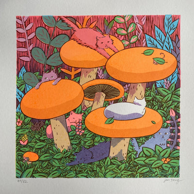 Colorful print of large orange mushrooms in a colorful forest with cats hanging around them.