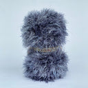 Back view of a fluffy plush hedgehog.